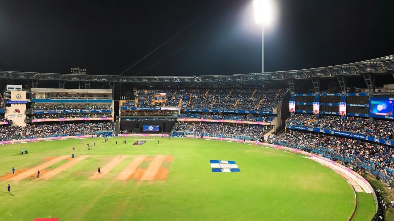 A floodlit cricket ground during a T20 match