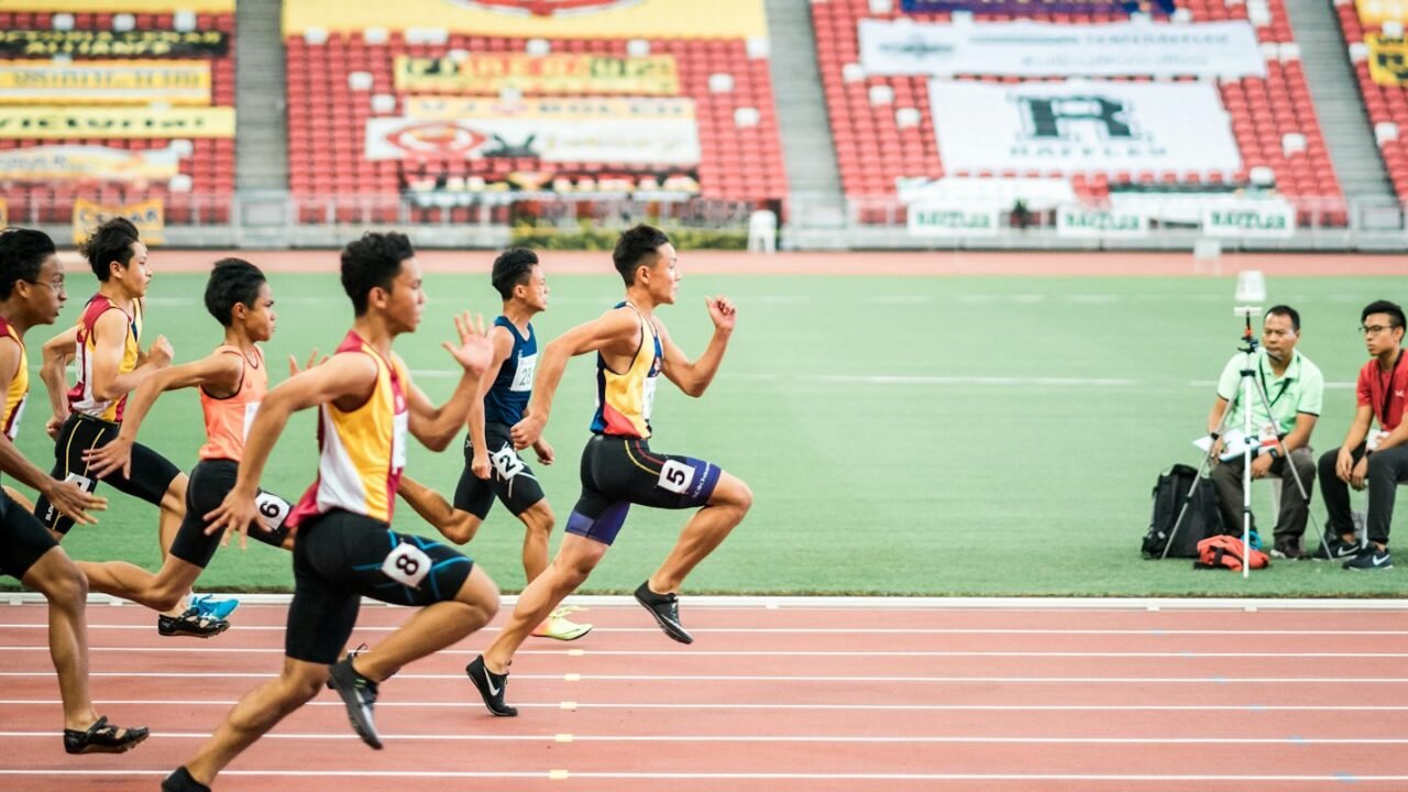 Runners racing on a stadium track