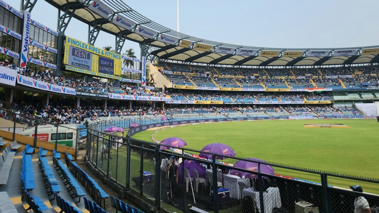 A packed cricket stadium seen from the upper stand